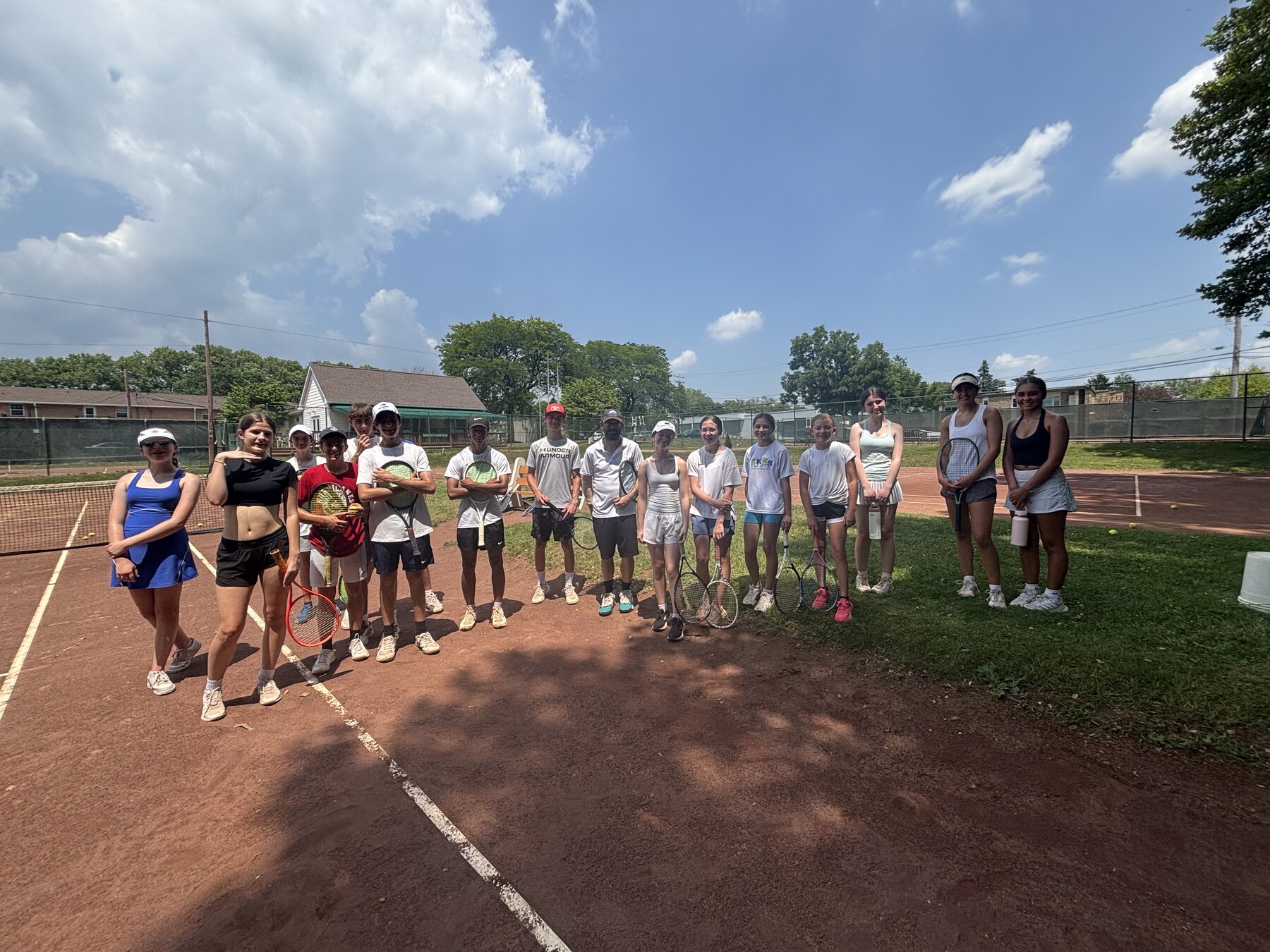 Players training on the Oakmont red-clay courts